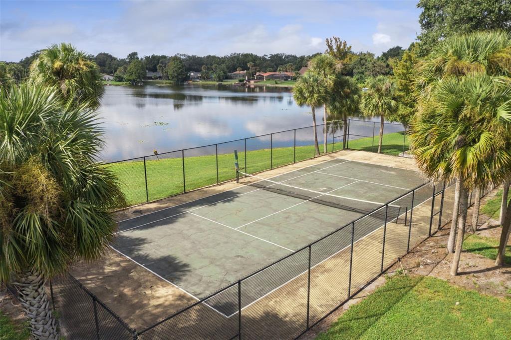 914 Lake Destiny Road, Unit G Altamonte Springs, FL 32714 - Photo 26 of 30 a view of a backyard and a lake view