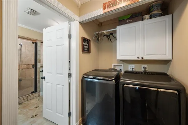 a utility room with dryer and washer