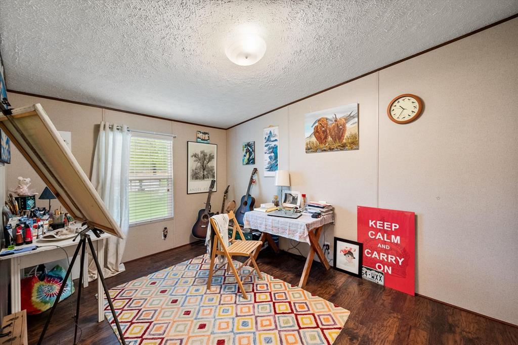 14036 Old Texaco Road Conroe, TX 77302 - Photo 31 of 40 a living room with furniture and a window