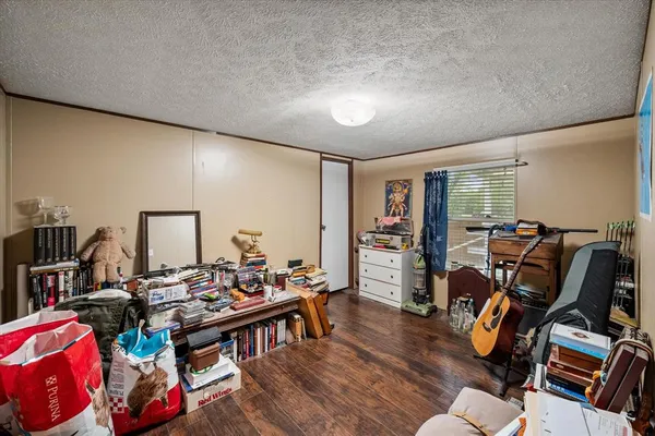 a view of a workspace with furniture and toys