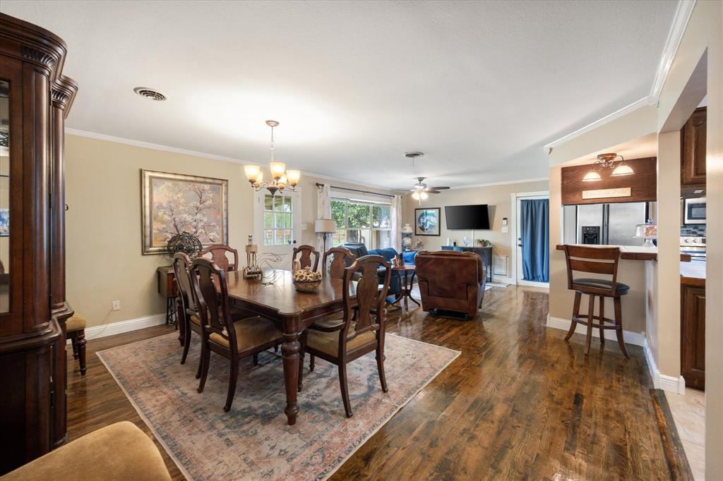 14036 Old Texaco Road Conroe, TX 77302 - Photo 9 of 40 a view of a dining room with furniture window and wooden floor