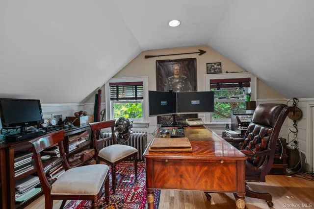 a outdoor space with furniture a flat screen tv and windows