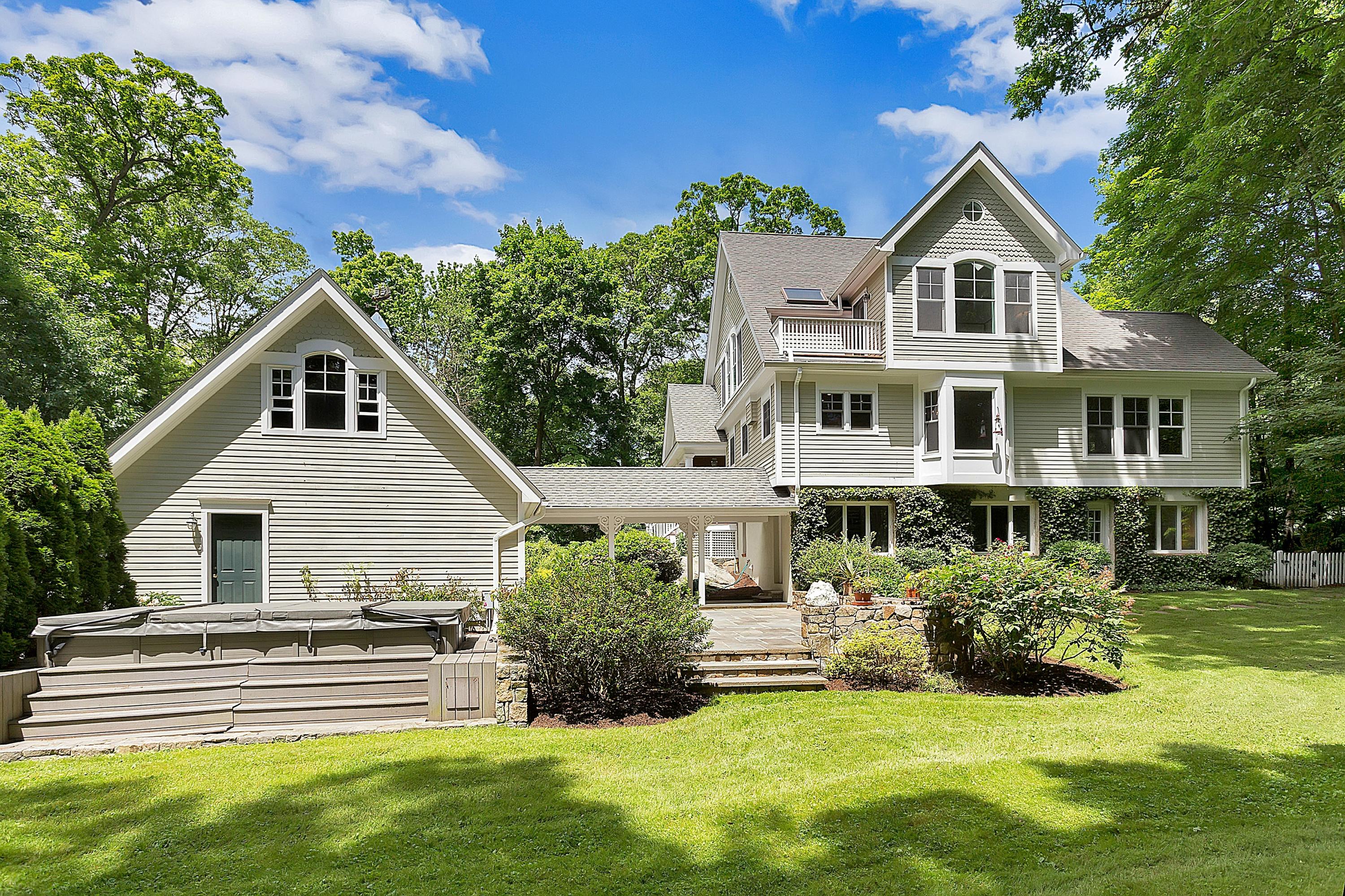 6 Wildcat Road Darien, CT 06820 - Photo 2 of 27 a front view of a house with a yard