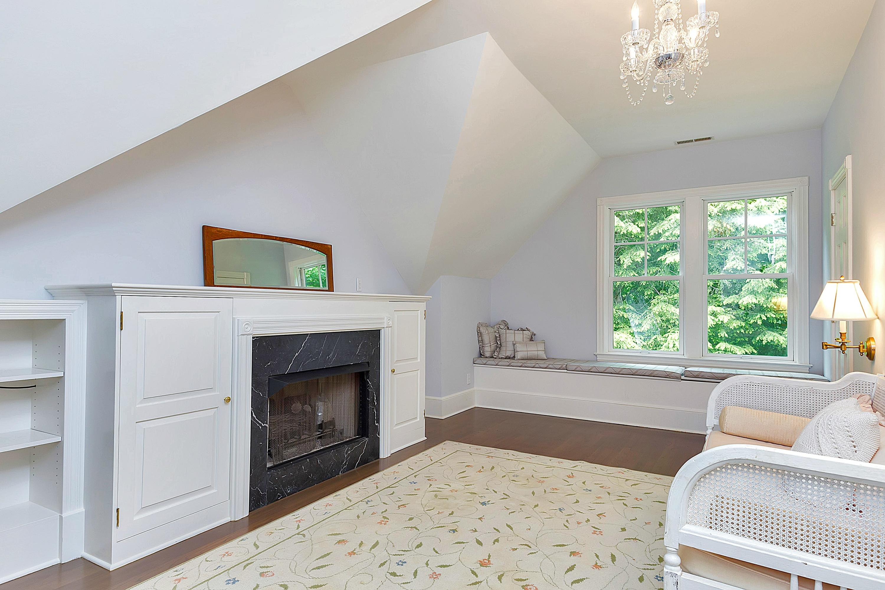 6 Wildcat Road Darien, CT 06820 - Photo 14 of 27 a living room with furniture and a fireplace