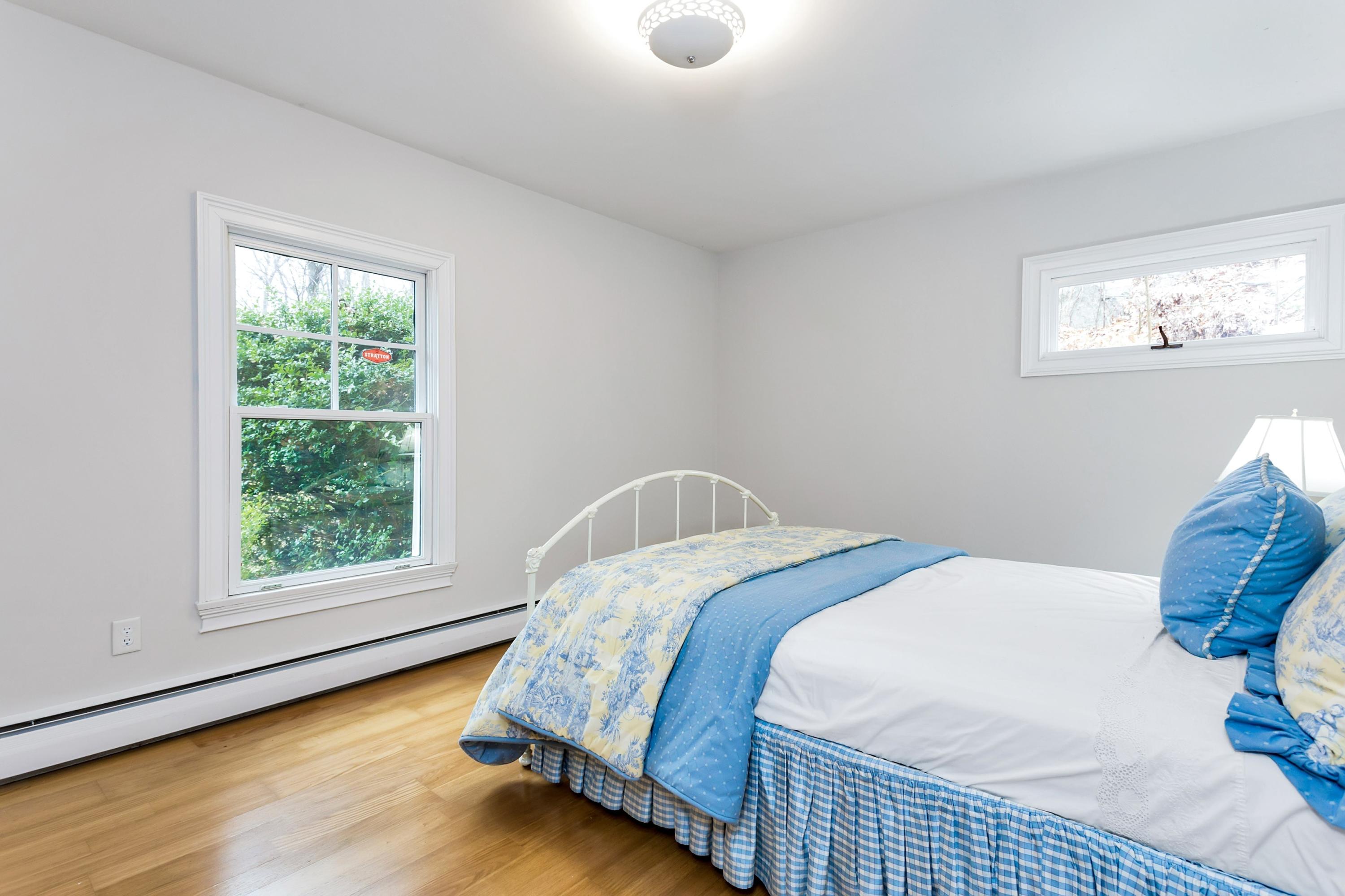 6 Wildcat Road Darien, CT 06820 - Photo 20 of 27 a bed sitting in a bedroom next to a window