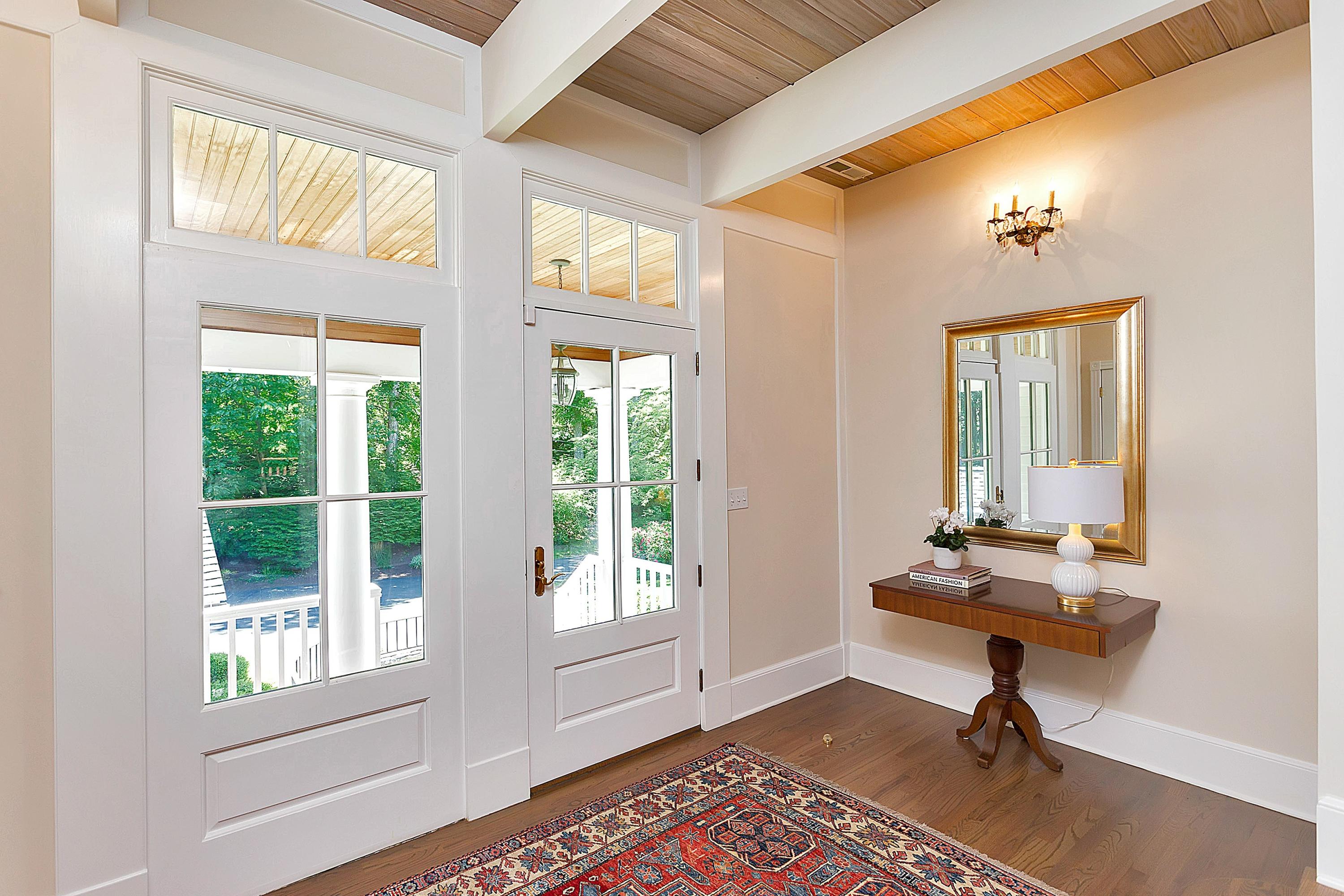 6 Wildcat Road Darien, CT 06820 - Photo 3 of 27 a view of a livingroom with lounge chair and a large window
