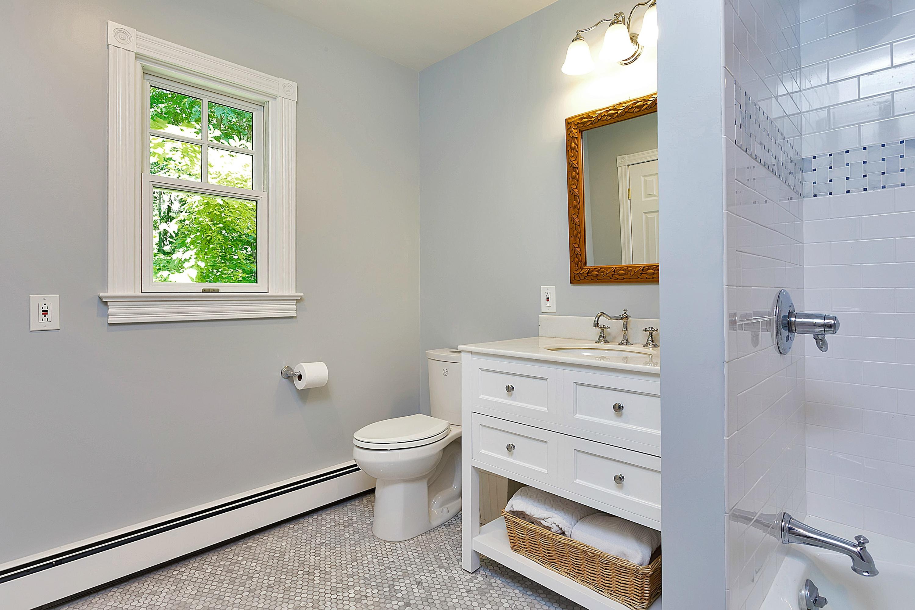 6 Wildcat Road Darien, CT 06820 - Photo 21 of 27 a bathroom with a sink a toilet and a mirror