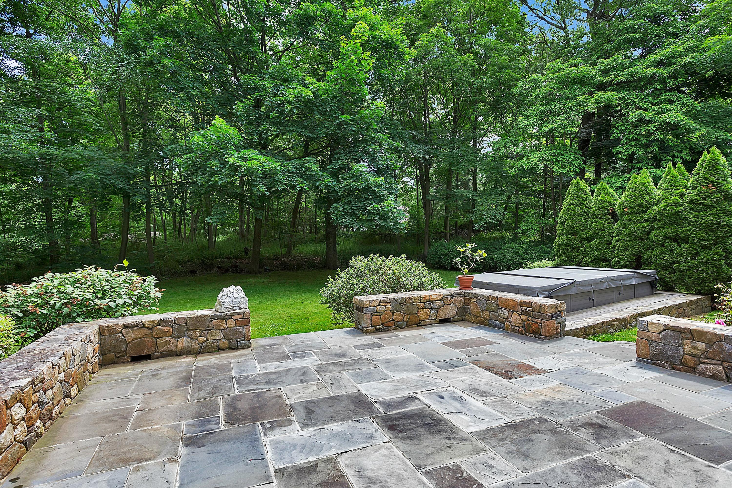 6 Wildcat Road Darien, CT 06820 - Photo 24 of 27 a front view of a house with garden