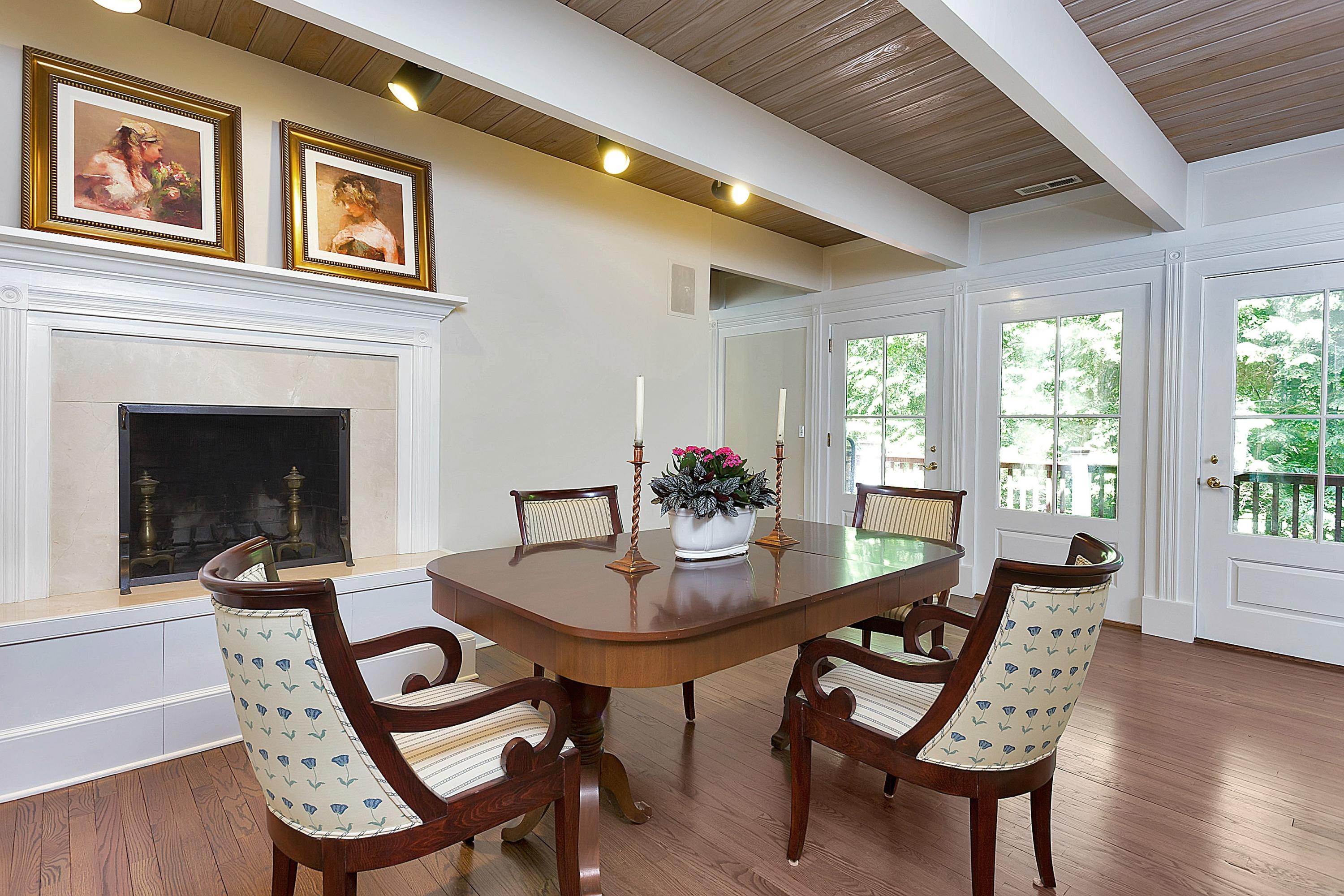 6 Wildcat Road Darien, CT 06820 - Photo 6 of 27 a dining room with furniture a fireplace and wooden floor