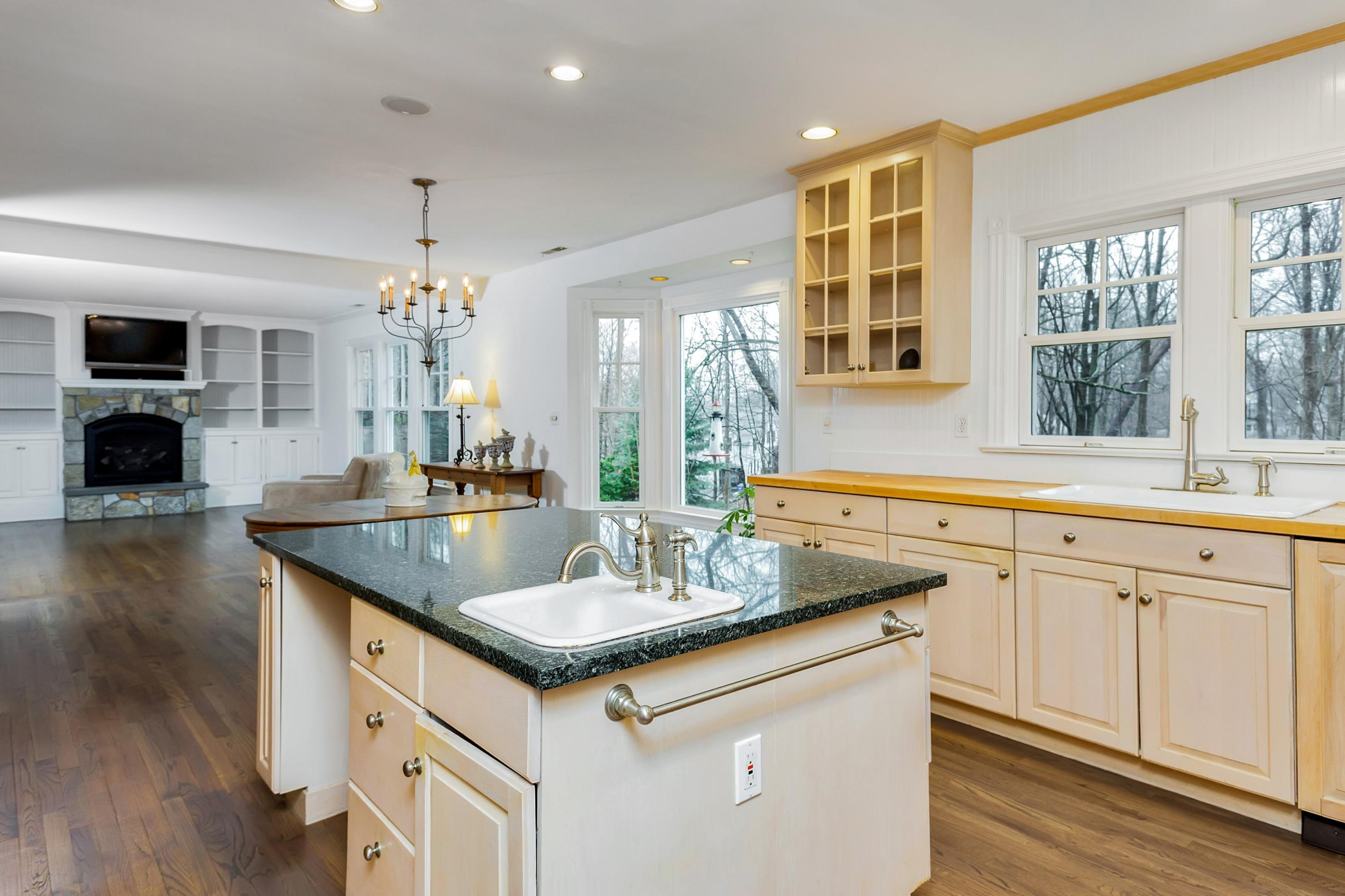 6 Wildcat Road Darien, CT 06820 - Photo 9 of 27 a kitchen with a sink and a stove top oven