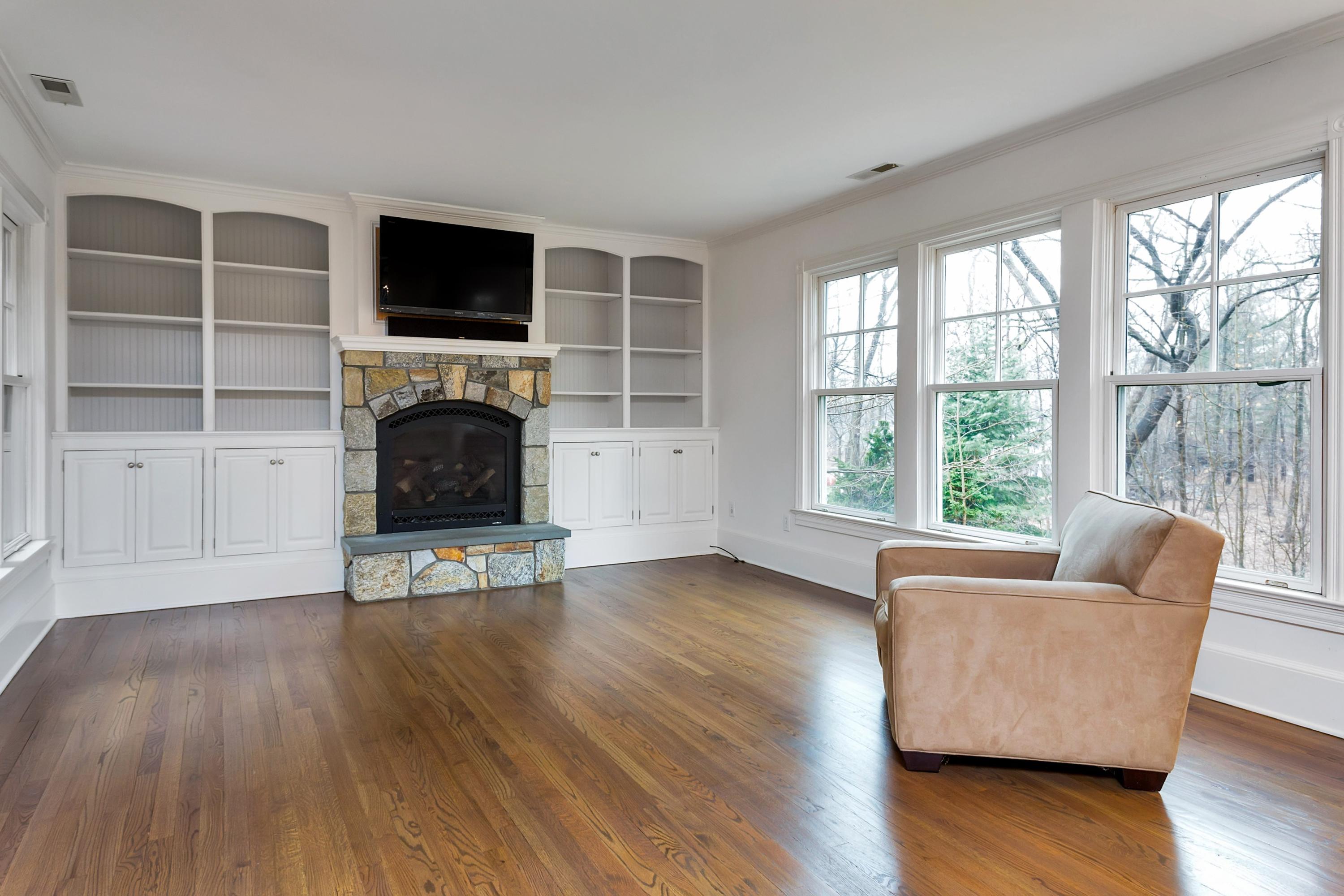 6 Wildcat Road Darien, CT 06820 - Photo 10 of 27 a living room with furniture and a flat screen tv