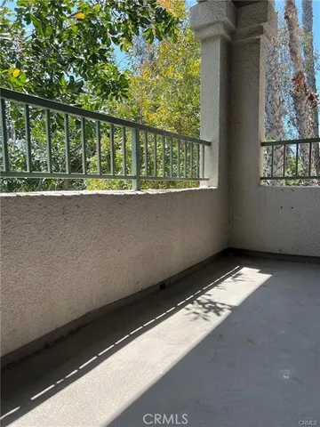 a group of potted plants in front of a building