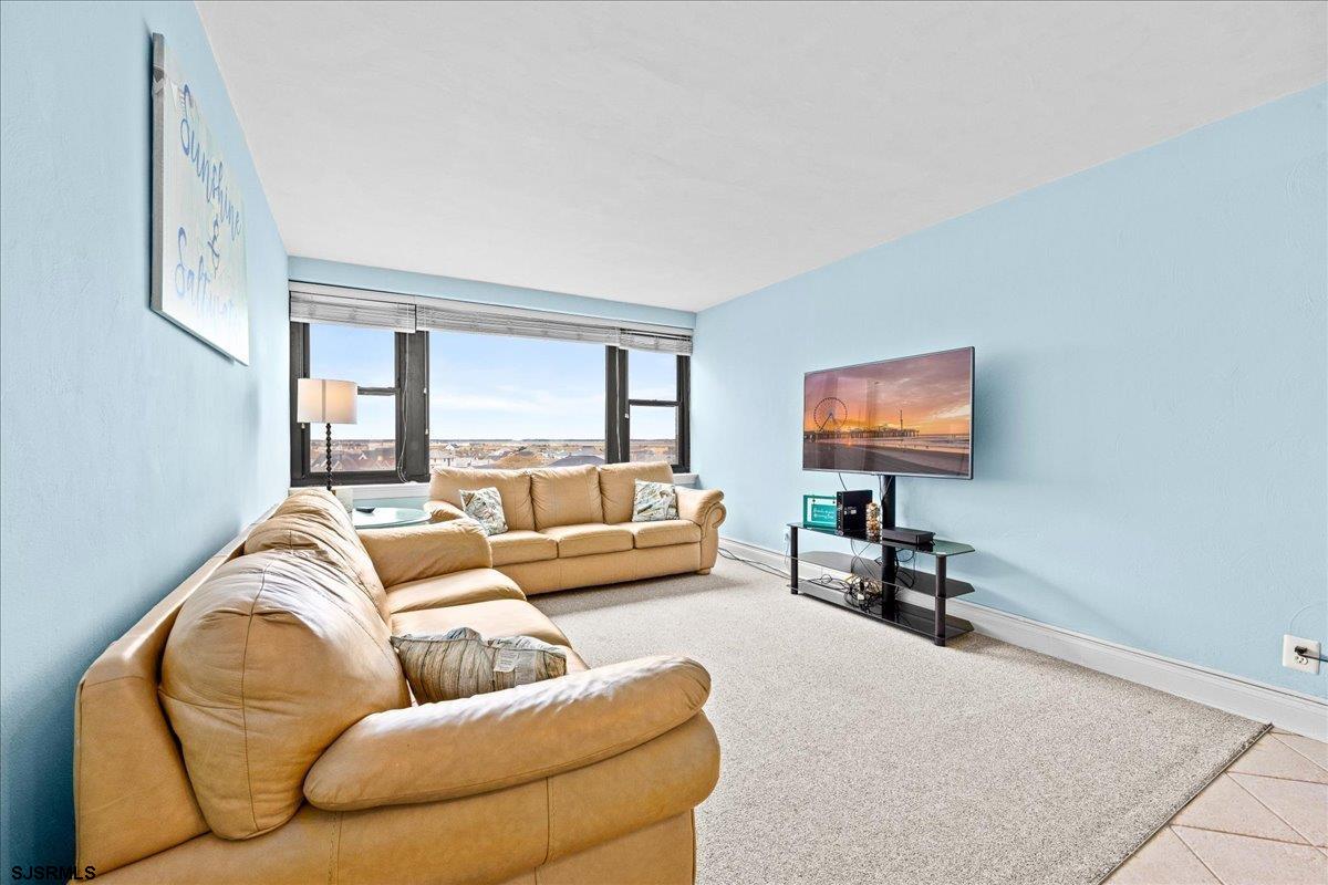 101 South Raleigh Avenue, Unit 619 Atlantic City, NJ 08401 - Photo 17 of 24 a living room with furniture and a flat screen tv