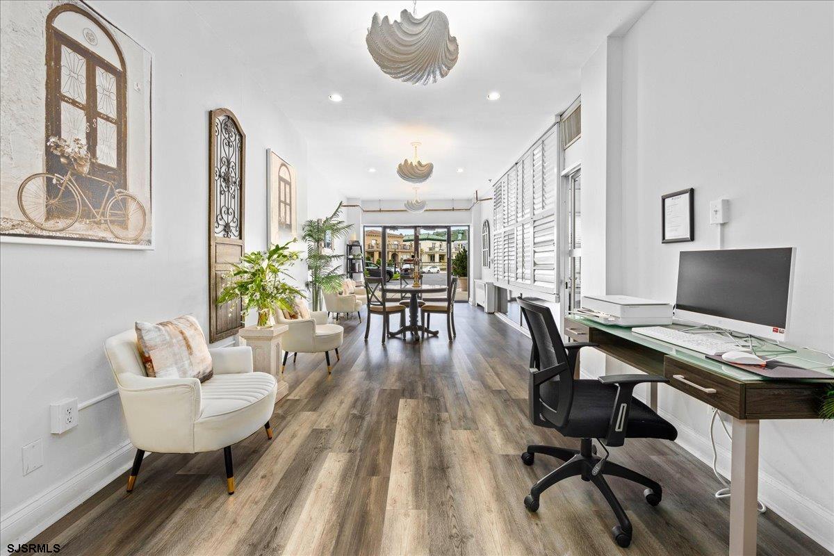 101 South Raleigh Avenue, Unit 619 Atlantic City, NJ 08401 - Photo 18 of 24 a workspace with furniture and a wooden floor