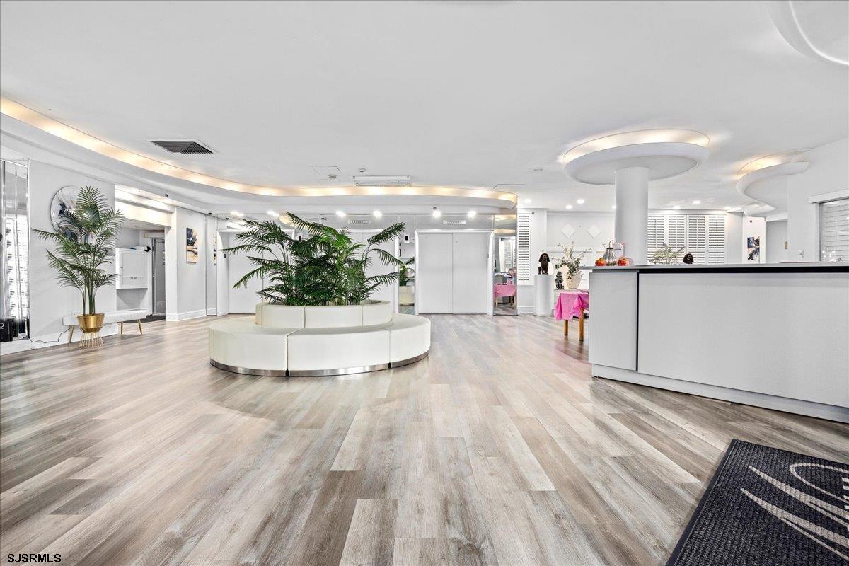 101 South Raleigh Avenue, Unit 619 Atlantic City, NJ 08401 - Photo 22 of 24 a view of a living room and kitchen with stainless steel appliances
