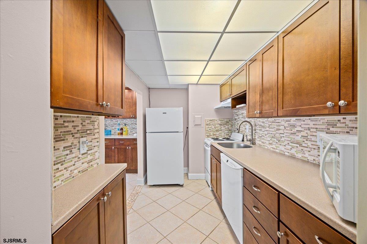 101 South Raleigh Avenue, Unit 619 Atlantic City, NJ 08401 - Photo 9 of 24 a kitchen with a sink cabinets and appliances
