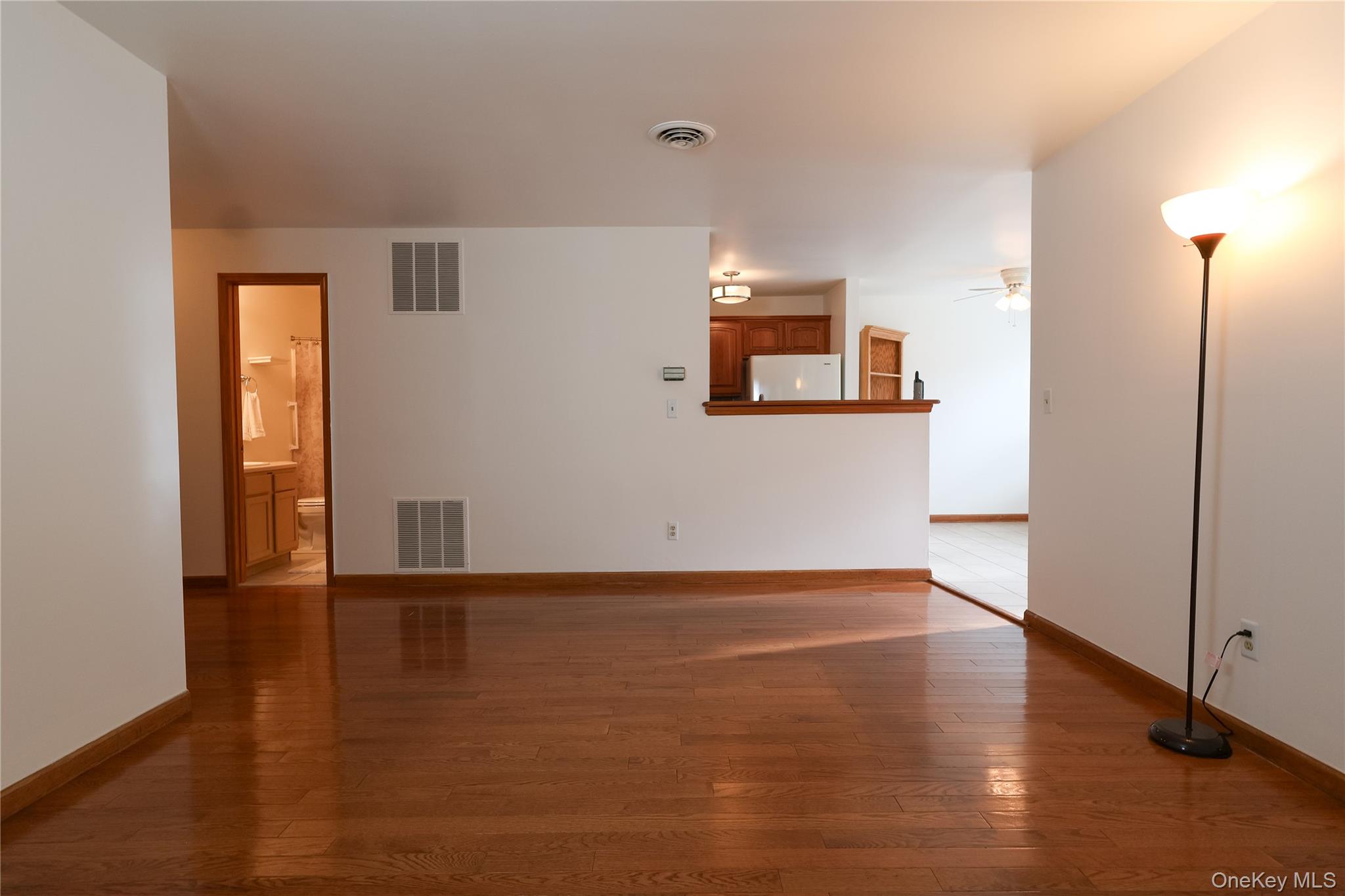 1306 Rosewood Court Highland Mills, NY 10930 - Photo 11 of 44 Unfurnished living room with dark wood-type flooring and ceiling fan