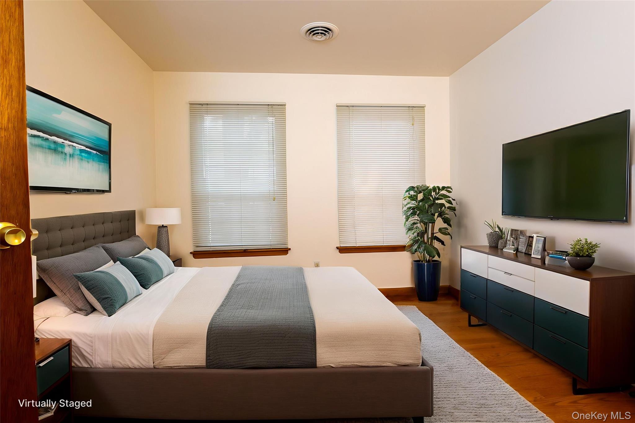 1306 Rosewood Court Highland Mills, NY 10930 - Photo 15 of 44 a bedroom with a bed and a flat screen tv