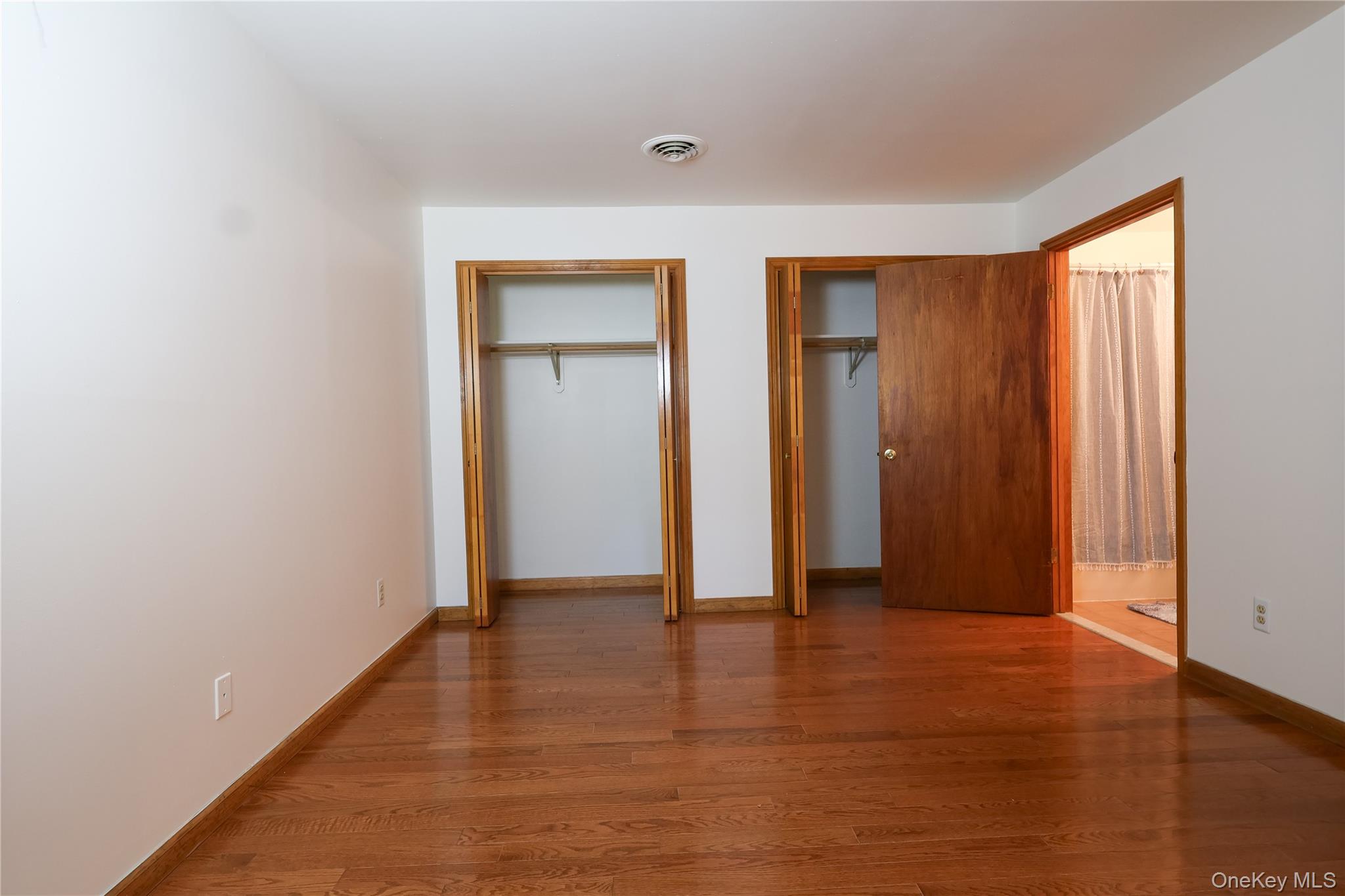 1306 Rosewood Court Highland Mills, NY 10930 - Photo 20 of 44 Unfurnished bedroom with multiple closets and wood finished floors