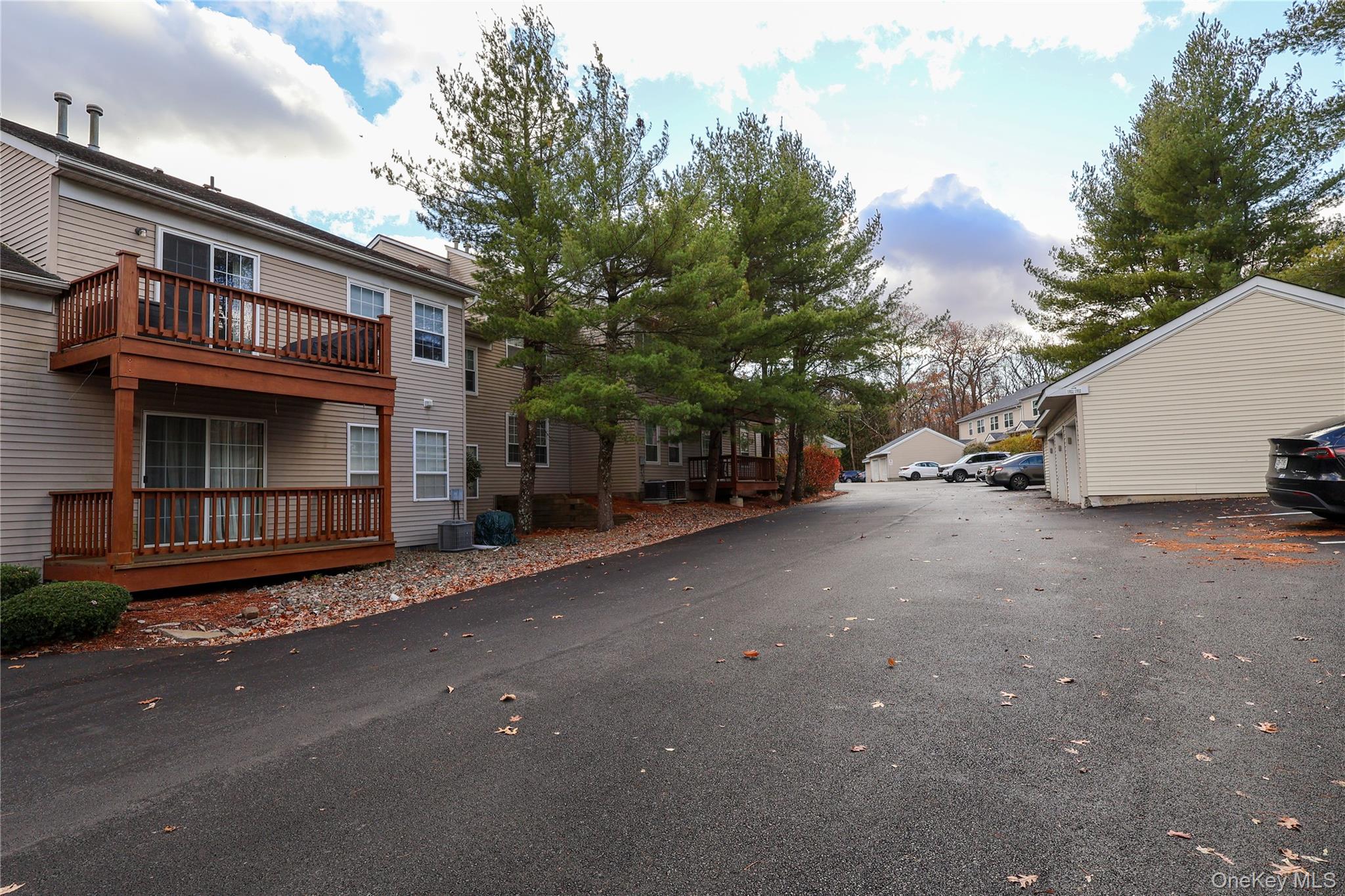 1306 Rosewood Court Highland Mills, NY 10930 - Photo 32 of 44 a view of a car park in front of a house