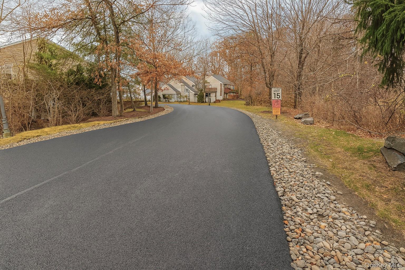 1306 Rosewood Court Highland Mills, NY 10930 - Photo 33 of 44 a view of a road with snow on the road