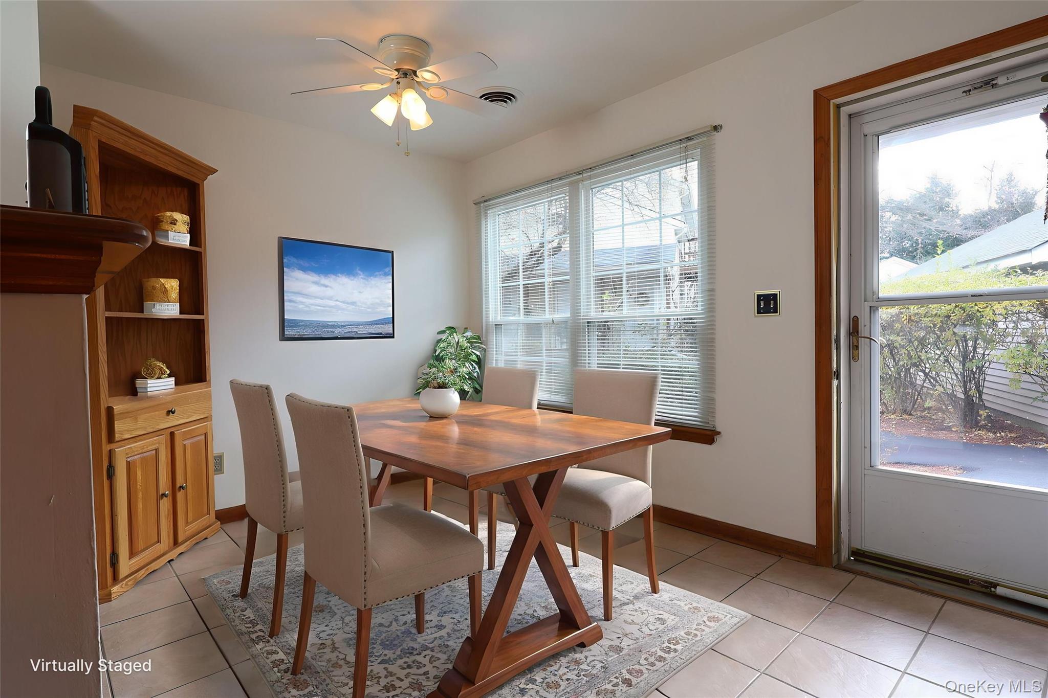 1306 Rosewood Court Highland Mills, NY 10930 - Photo 6 of 44 a view of a dining room with furniture window and outside view