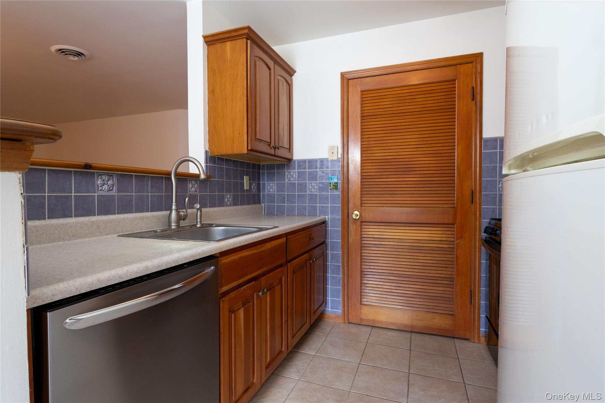 1306 Rosewood Court Highland Mills, NY 10930 - Photo 7 of 44 a bathroom with a sink and a mirror