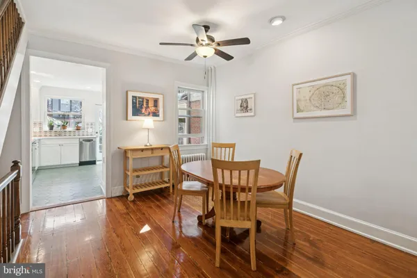 a dining room with furniture and window