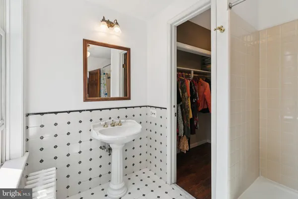 a bathroom with a bathtub and shower
