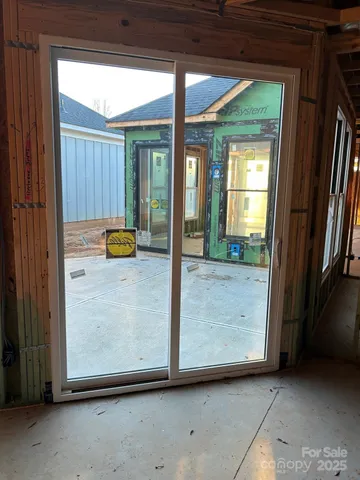 a bed sitting in a room next to a window