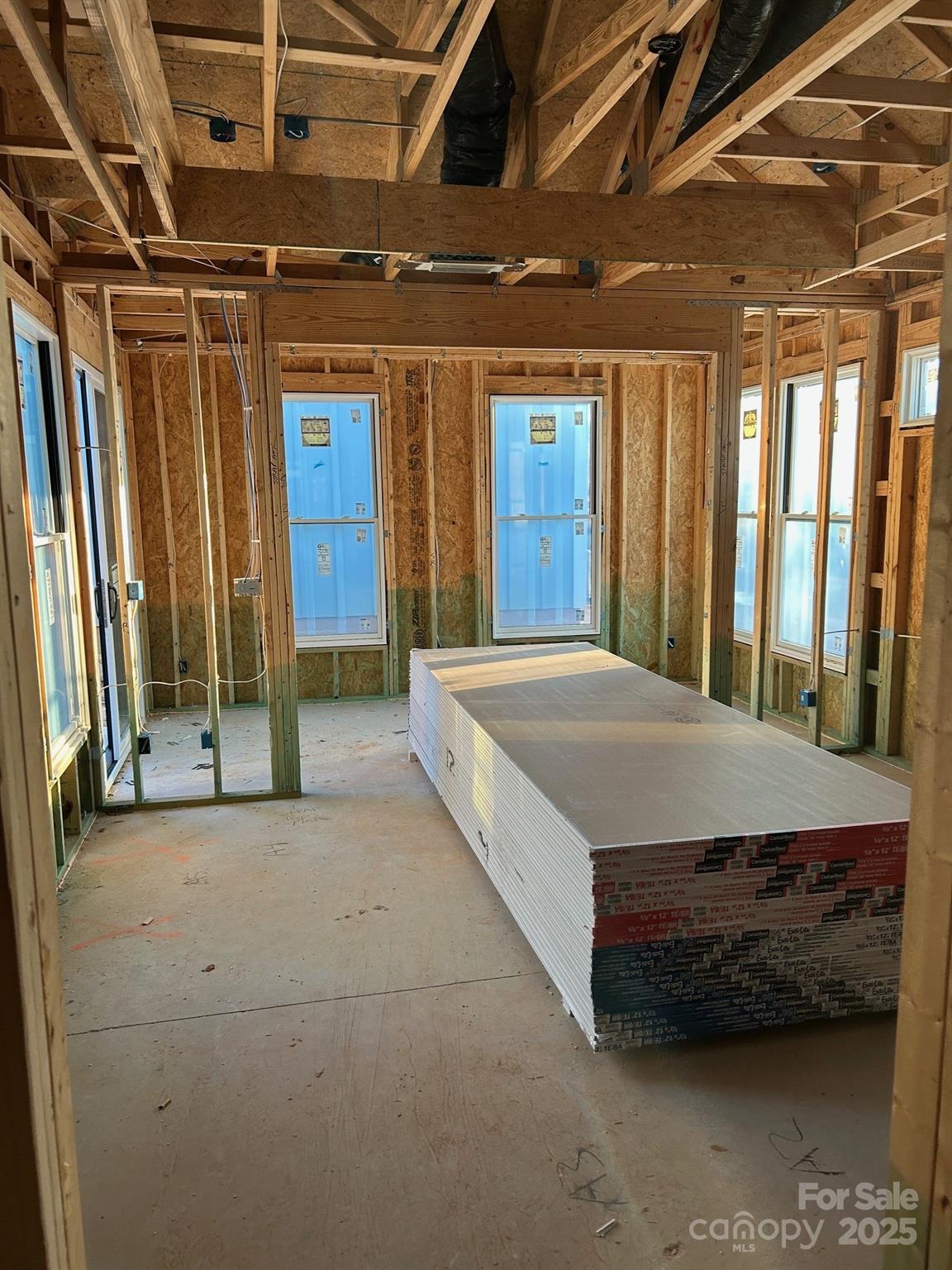 3044 Five Creek Road Charlotte, NC 28213 - Photo 10 of 15 a bed sitting in a room next to a window