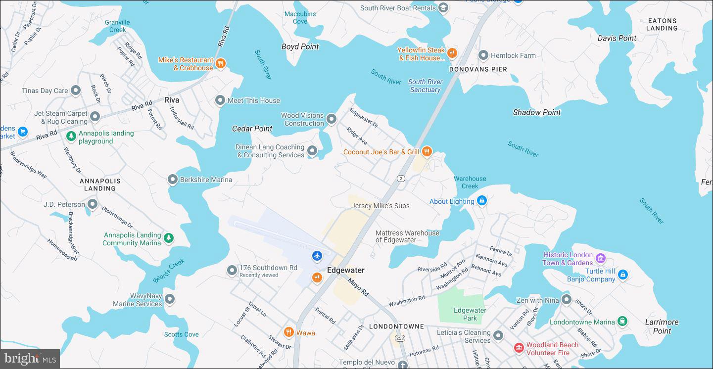 176 Southdown Road Edgewater, MD 21037 - Photo 12 of 13 a white and a vase of flowers sitting on a table