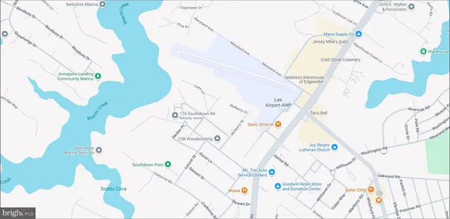 a white and a vase of flowers sitting on a table