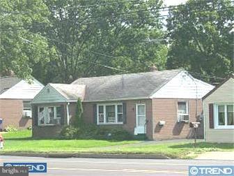 655 West County Line Road Hatboro, PA 19040 - Photo 1 of 1 a front view of a house with a yard with garage