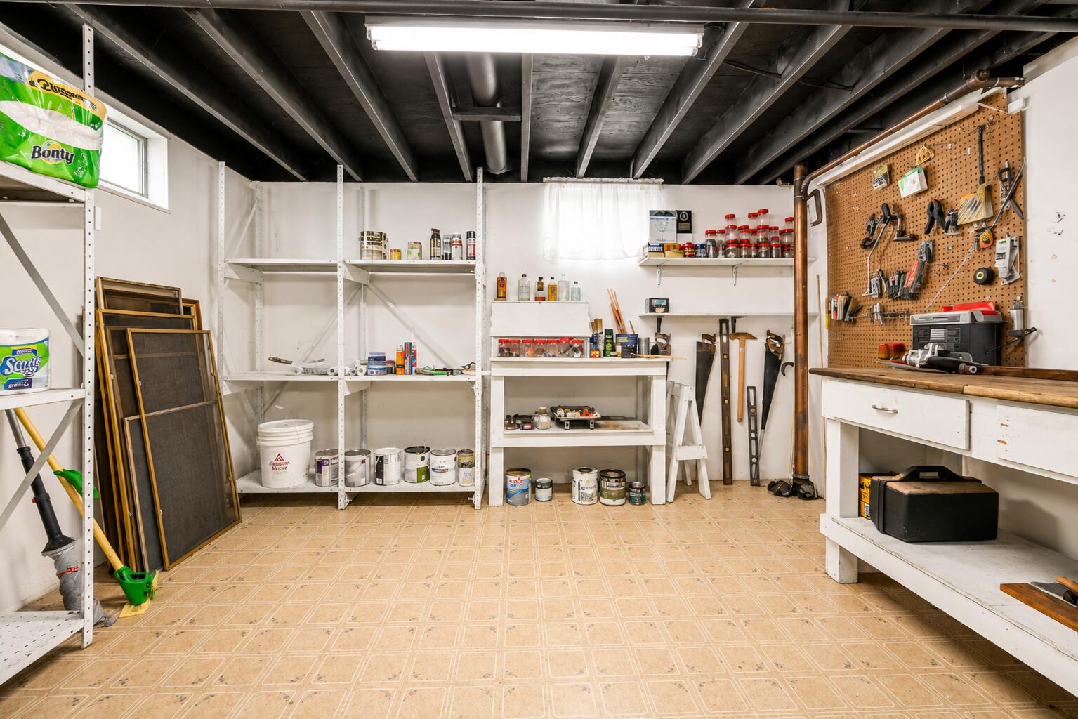 4428 Phoenix Drive Springfield, OH 45503 - Photo 25 of 35 Work bench abd shelving convey