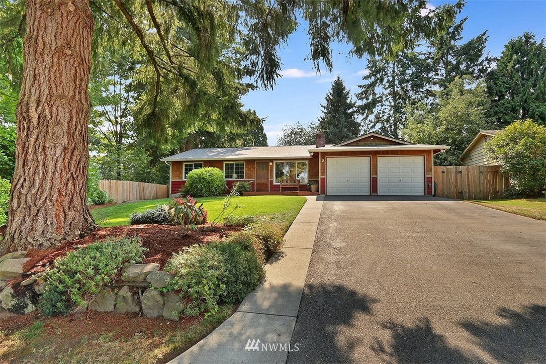 2 222nd Street Southwest Bothell, WA 98021 - Photo 2 of 29 a front view of a house with a yard and potted plants