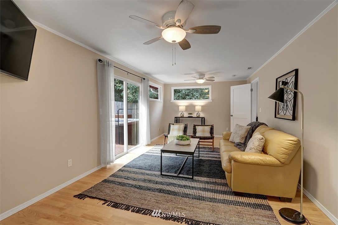 2 222nd Street Southwest Bothell, WA 98021 - Photo 12 of 29 a living room with furniture and a chandelier
