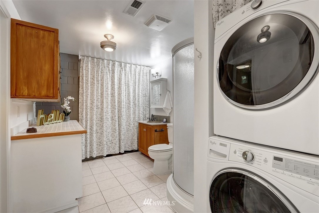 2 222nd Street Southwest Bothell, WA 98021 - Photo 16 of 29 a view of a bathroom with a sink and a washer dryer