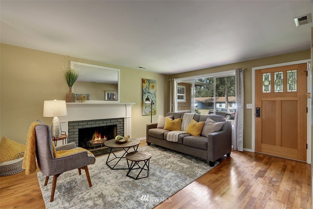 2 222nd Street Southwest Bothell, WA 98021 - Photo 4 of 29 a living room with furniture and a fireplace
