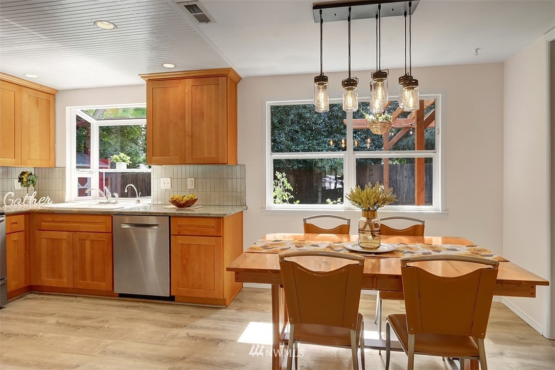 2 222nd Street Southwest Bothell, WA 98021 - Photo 5 of 29 a kitchen with a sink cabinets and dining table chair