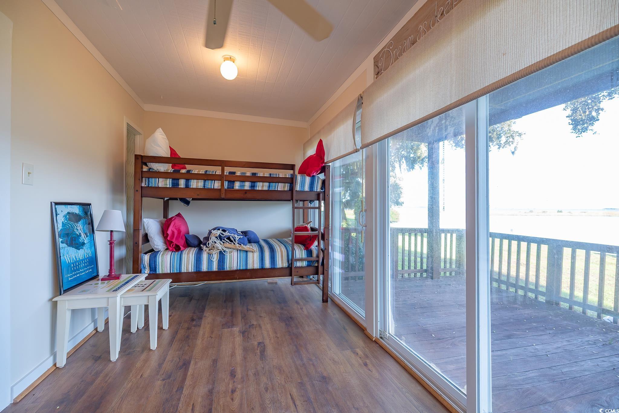 117 Finch Drive, Unit 272 Georgetown, SC 29440 - Photo 12 of 36 Bedroom featuring ornamental molding, dark wood finished floors, access to outside, and ceiling fan