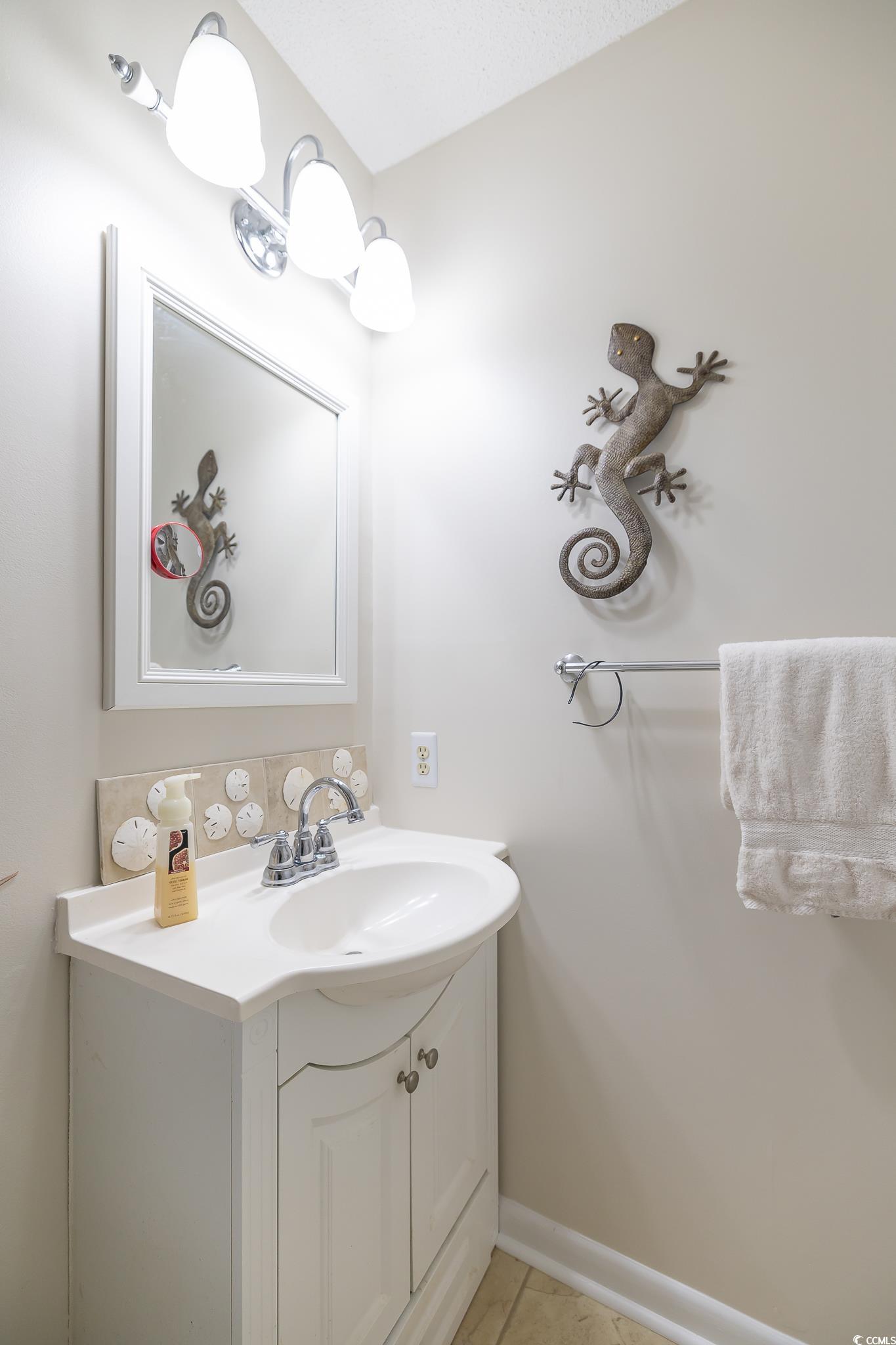 117 Finch Drive, Unit 272 Georgetown, SC 29440 - Photo 14 of 36 Bathroom featuring vanity and light tile patterned floors