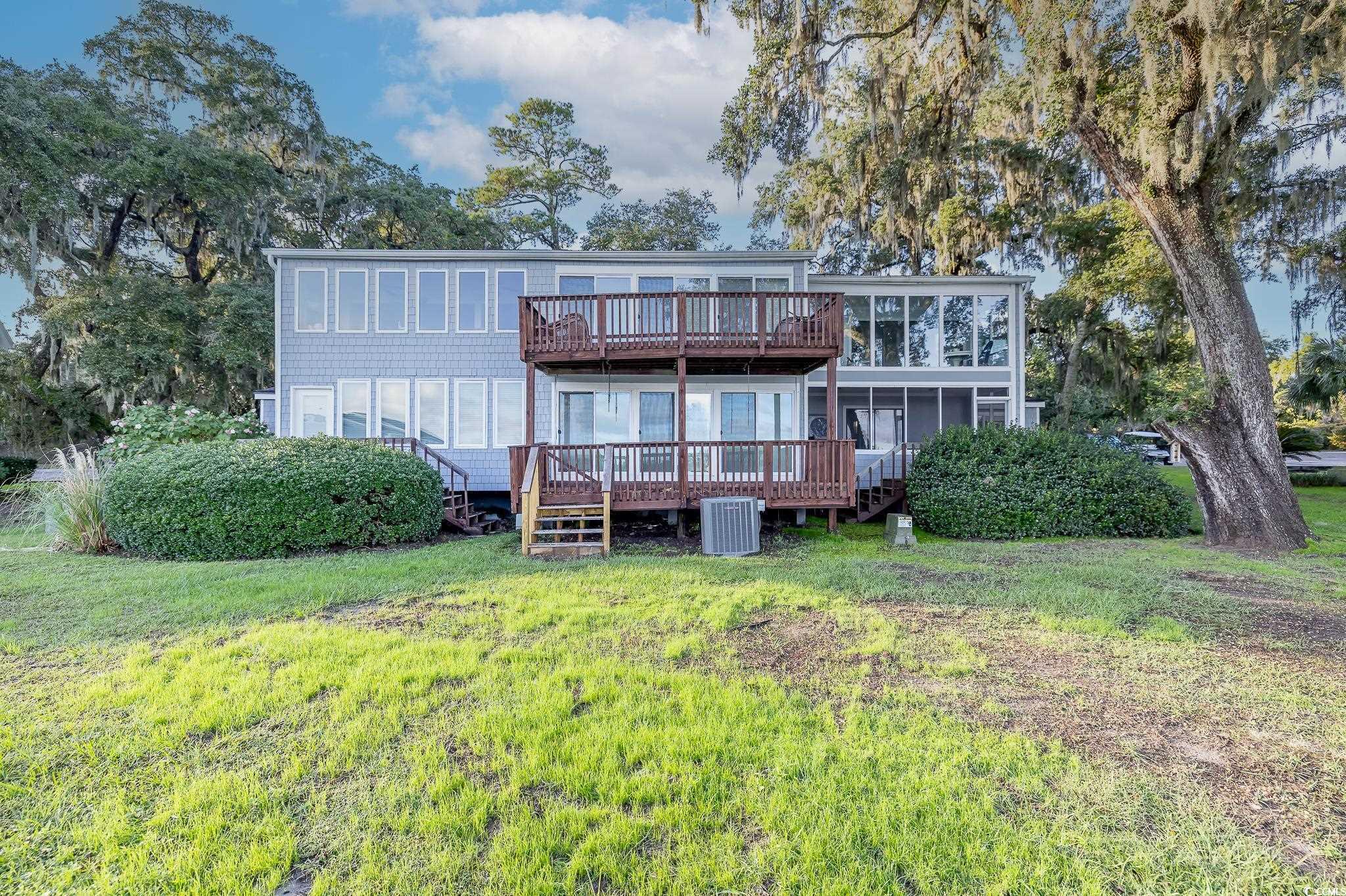 117 Finch Drive, Unit 272 Georgetown, SC 29440 - Photo 5 of 36 Back of property with a wooden deck and a lawn