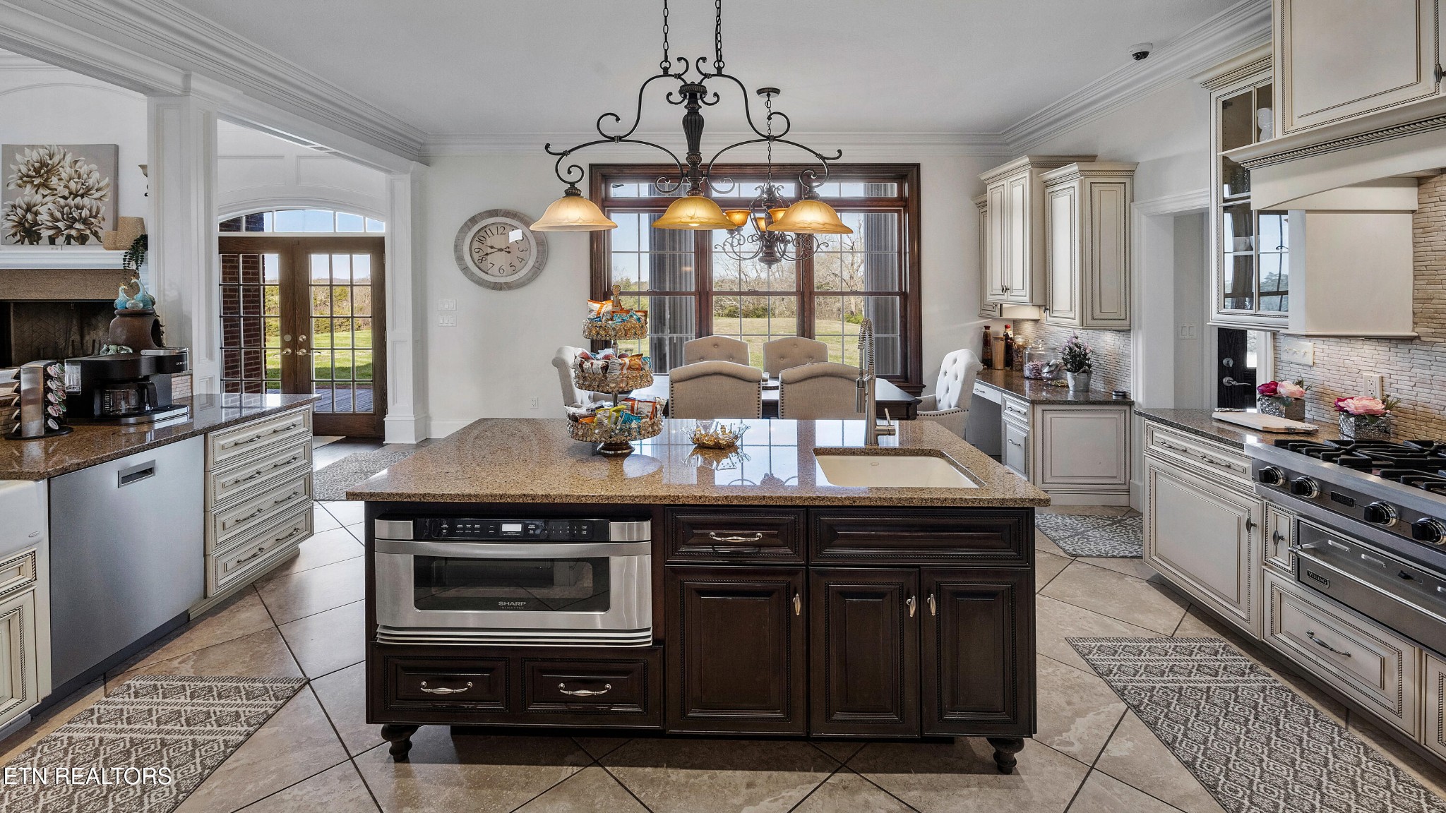 3050 Sims Road Sevierville, TN 37876 - Photo 21 of 59 a kitchen with a table chairs stove and cabinets
