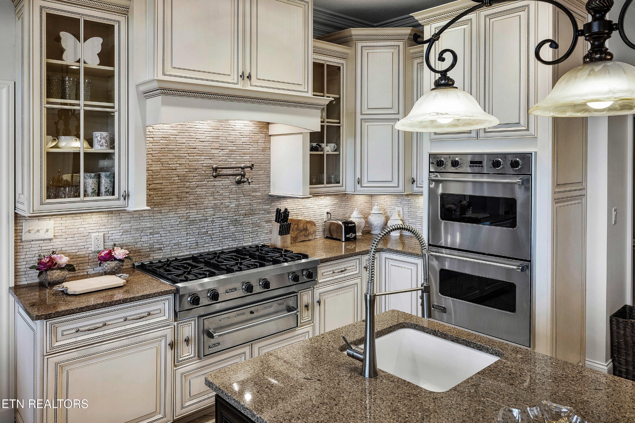 3050 Sims Road Sevierville, TN 37876 - Photo 24 of 59 a kitchen with stainless steel appliances granite countertop a stove and a microwave
