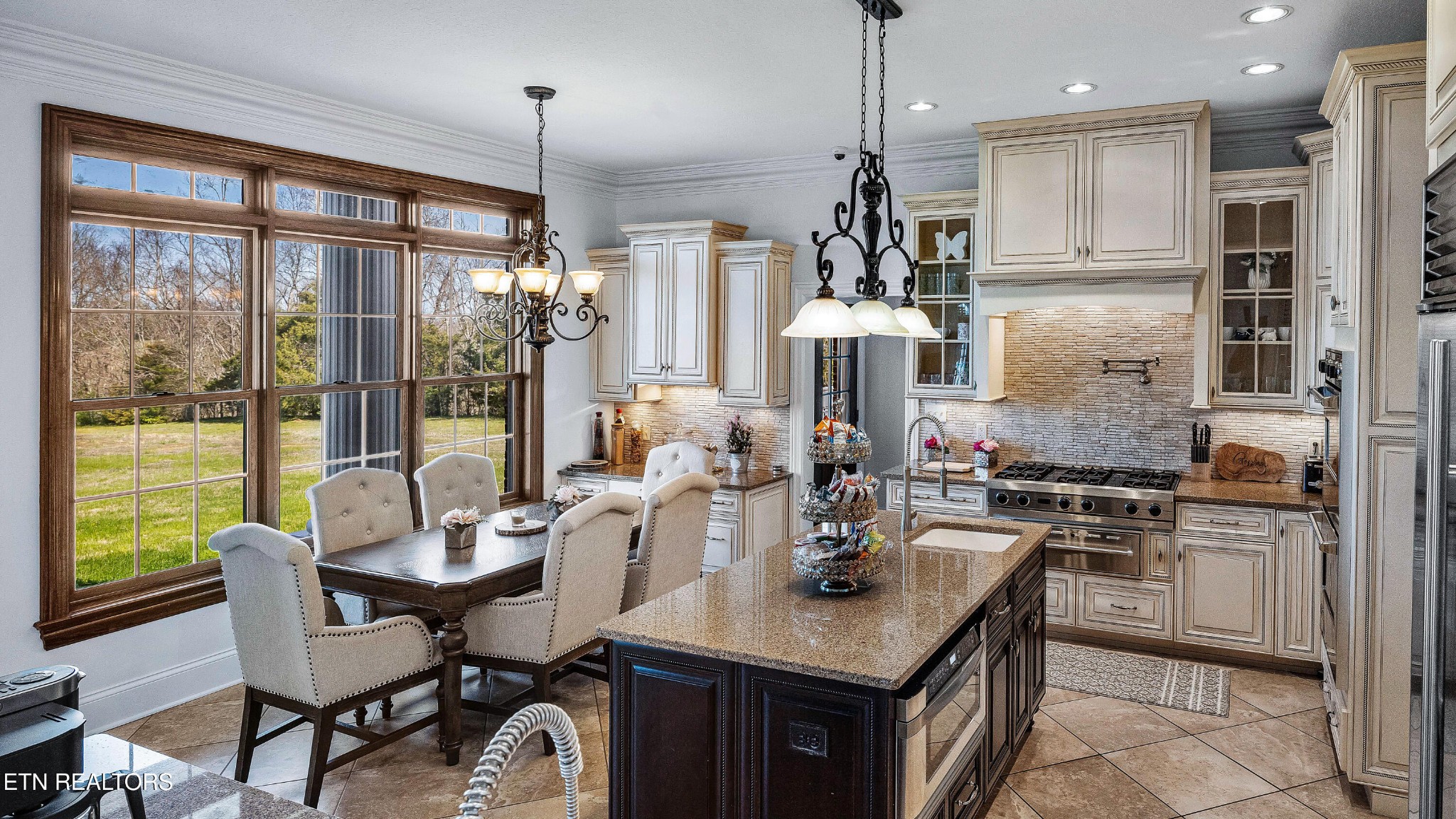 3050 Sims Road Sevierville, TN 37876 - Photo 33 of 59 a kitchen with a table chairs stove and refrigerator