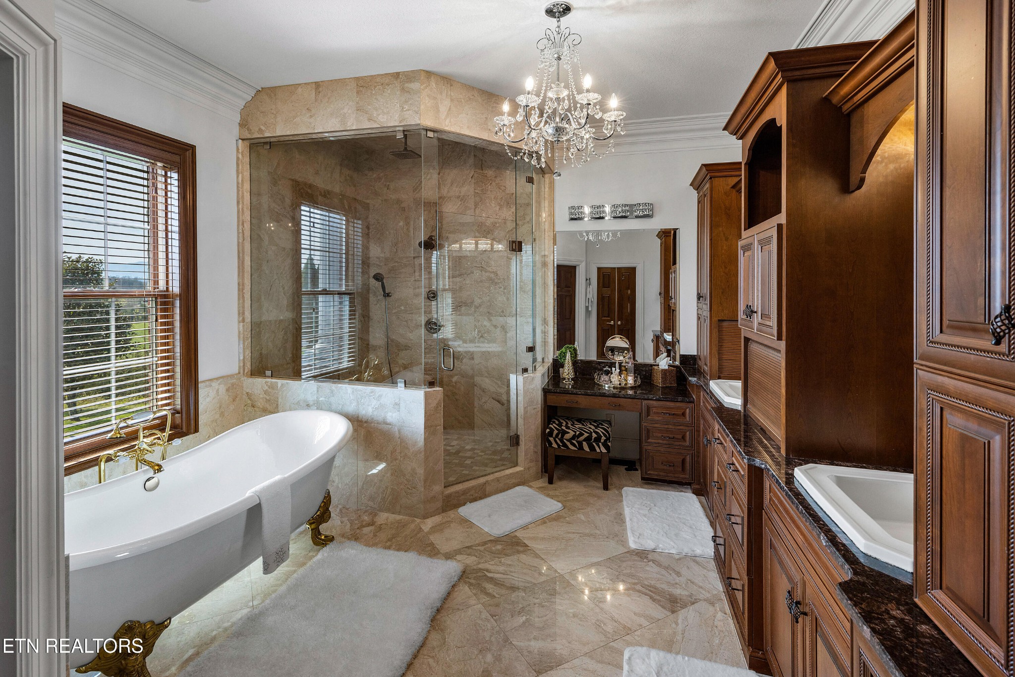 3050 Sims Road Sevierville, TN 37876 - Photo 39 of 59 a spacious bathroom with a granite countertop tub sink a mirror and a shower