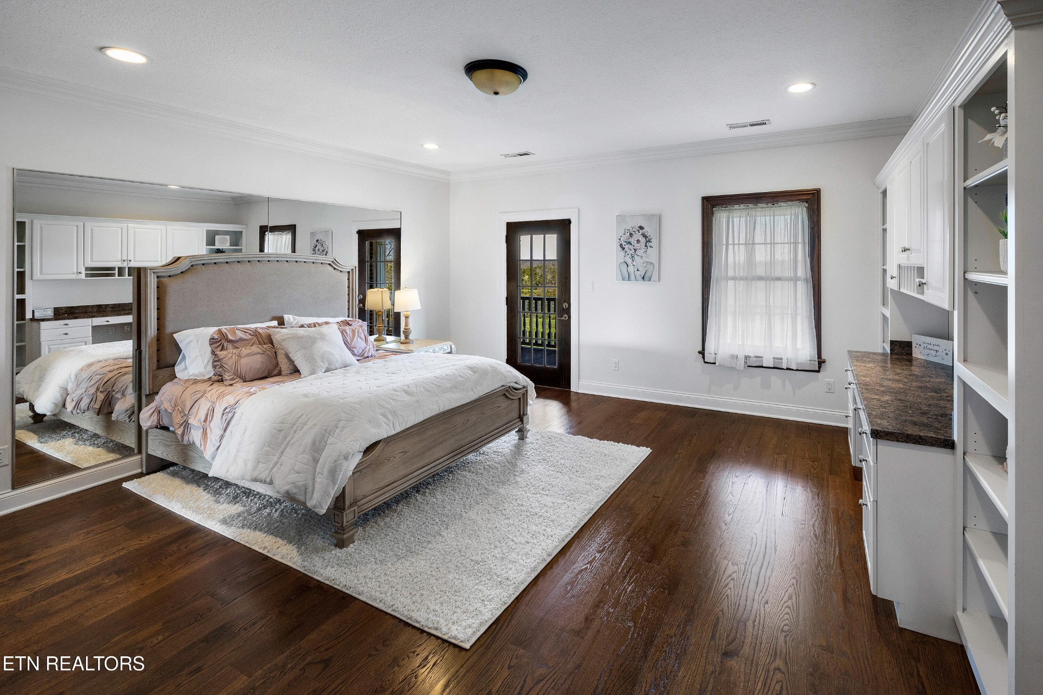 3050 Sims Road Sevierville, TN 37876 - Photo 48 of 59 a bedroom with a large bed and wooden floor