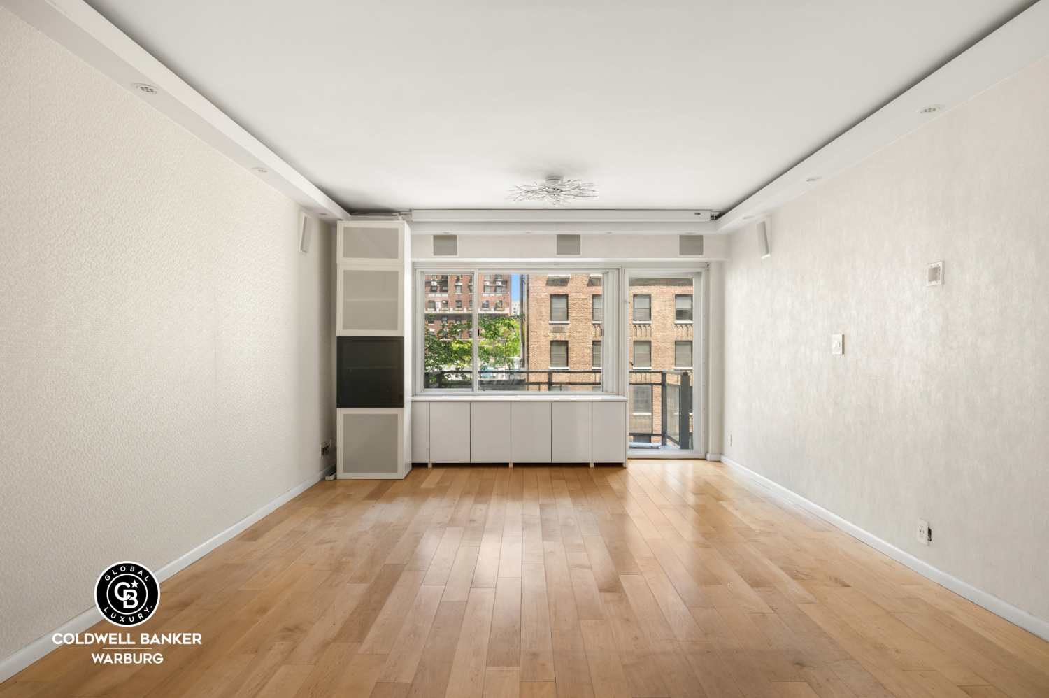 118 East 60th Street, Unit 7B Manhattan, NY 10022 - Photo 3 of 15 a view of an empty room with a window