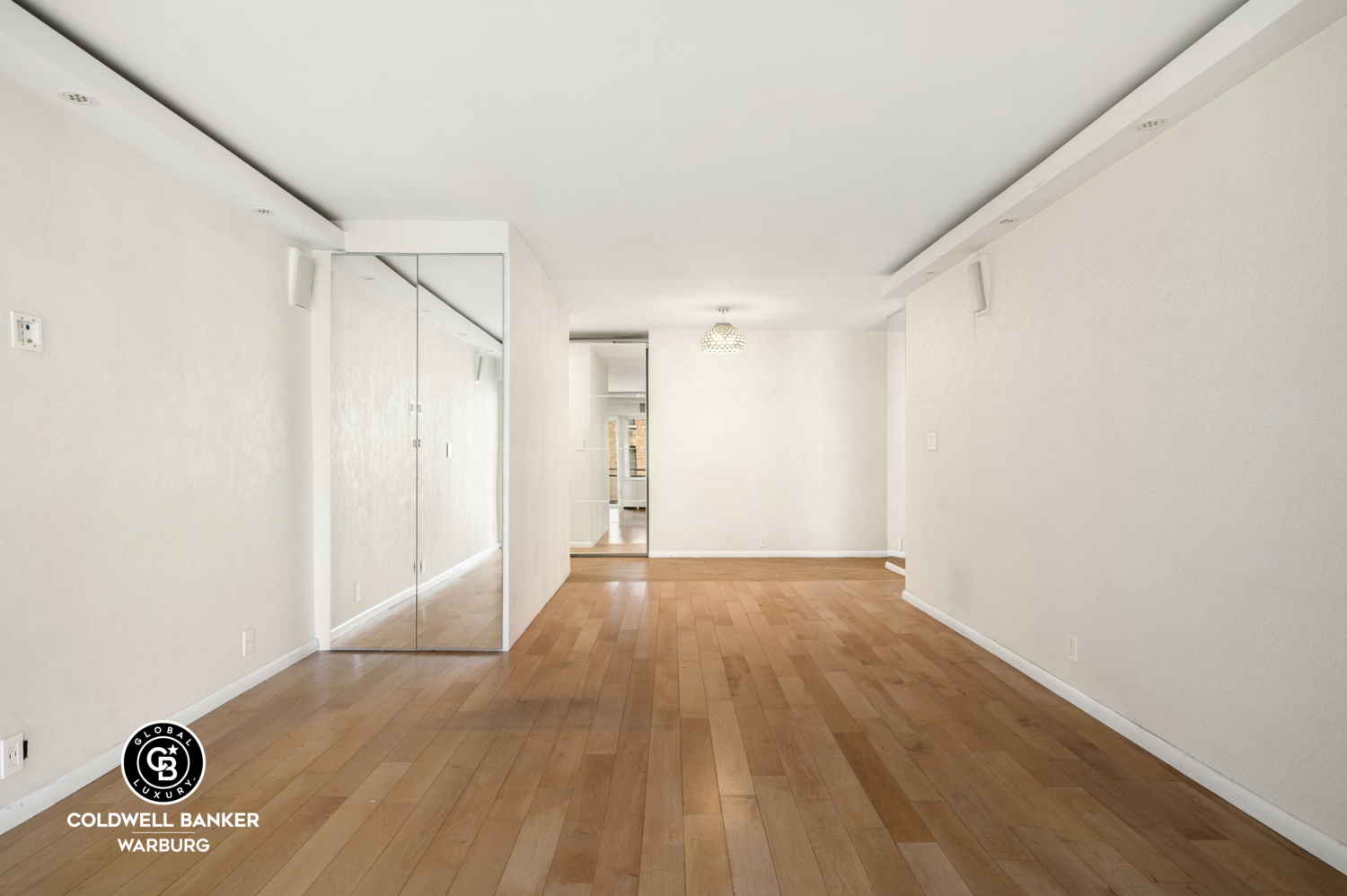 118 East 60th Street, Unit 7B Manhattan, NY 10022 - Photo 4 of 15 a view of an empty room with a window